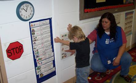 washingtoncounty1 teacher helping a child